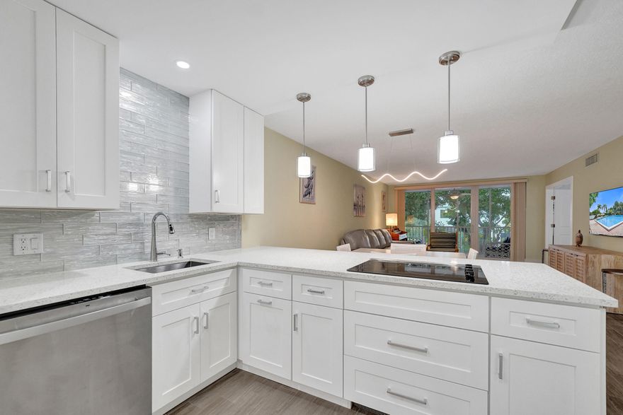 This is the one you've been looking for!!! Enjoy Florida  living at its finest in Palm Aire at Coral Key in Lighthouse Point. It's a cul-de-sac via land and a peninsula on the ICW with 1020' of seawall and 2040' of deep water boat dockage. This is a hidden gem, a quiet community in the highly desirable, boater's dream neighborhood on the ICW. This stunning, spacious and updated 2/2 unit is located in one of four garden apartments. Completely updated from modern baseboards to ceilings, doors, windows, bathrooms, kitchen and new A/C. Washer/Dryer located in the unit. Each building has a full size propane grill and a car washing station for resident's use. The community offers a clubhouse, large heated pool, shuffle board and beautiful manicured gardens directly on the ICW.