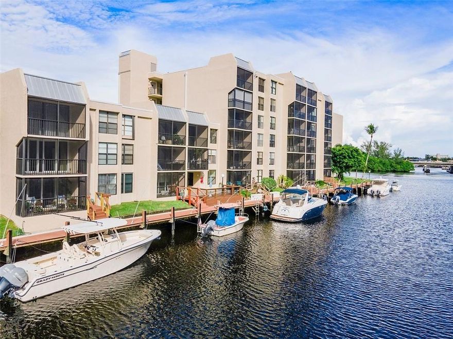 Rare & fabulous waterfront 2/2 condo including your own PRIVATE DOCK in Boca Bayou will not last!   Boat owner's DREAM, your boat is steps away from your 1st flr private patio looking at waterfront views from primary bdrm, kitchen & living areas.  Located in a premier GATED waterfront resort-style community, condo boasts bright open floor plan, updated chef's kitchen w/ granite counters, wood cabinets, SS appliances.  New luxury waterproof flooring throughout w/ 5" baseboards, dock & stairs redone in synthetic wood. Steps away from one of 5 pools, tennis, clubhouse & personal assigned parking. Minutes to BOCA BEACHES, Mizner Park, Trader Joes, Royal Palm Plaza.  Assoc fee incl reserves. Condo just completed complete concrete rest & 40-year maintenance/assessment is paid in full by Seller. Boaters, imagine staring at your Boat outside your bedroom window!! Boca Bayou, a premier gated, waterfront community, offers resort-style living in the heart of East Boca. Fabulous opportunity to purchase a 1st-floor condo w/its own private DEEDED DOCK that can accommodate a 28'-30' Boat; dock & stairs redone in synthetic wood. Bright, open-floorplan w/waterfront views from the primary BR & main living areas, new flooring throughout, 5" baseboards, updated kitchen w/SS Appl, granite count & wood cab. Relax on your private screened patio overlooking the water. Just steps to one of the five community pools. Assigned parking space close by. Gated comm, 5 pools, clubhouse & tennis. Just minutes to the beach, Mizner Park, Royal Palm, +. Assoc fee includes Full Reserves.Just minutes to BOCA BEACHES  (residents enjoy for a small fee a yearly beach parking pass), Mizner Park, Trader Joes, Royal Palm Plaza, + association fee incl reserves, condo just completed complete concrete restoration & 40 yr & Owner paying assessment!