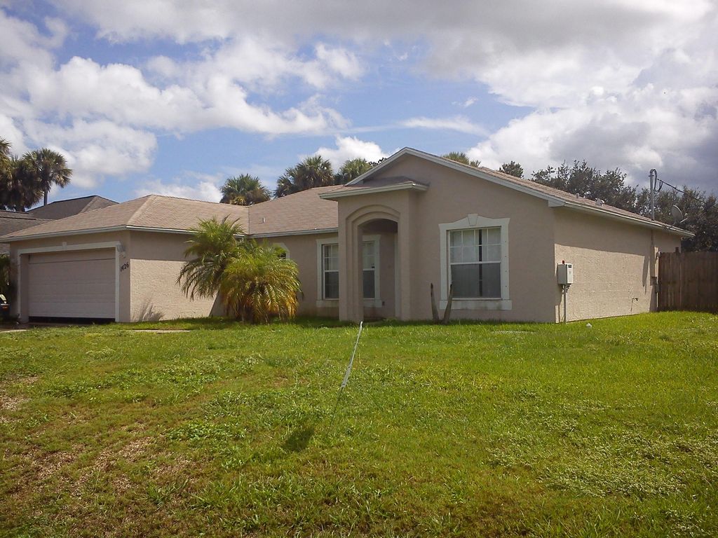 Photo of 1426 SW Maywall Avenue Ave, Port Saint Lucie, FL 34953 (MLS # R10811789)