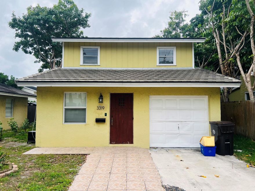 Charming and conveniently located, this cozy home is just minutes from downtown West Palm Beach, CityPlace, and the beach. The layout offers 2 bedrooms and 1 full bath, plus a versatile first-floor den/office or optional third bedroom created from a garage conversion. The remodeled kitchen features wood cabinetry, granite countertops, and a full appliance package. The bathroom has been completely updated, and the interior has been freshly painted and is move-in ready. Washer and dryer included. Ample front parking accommodates 3-4 vehicles. Ideally situated just two blocks from the Intracoastal Waterway and close to supermarkets, shopping, dining, Palm Beach International Airport, and major expressways.