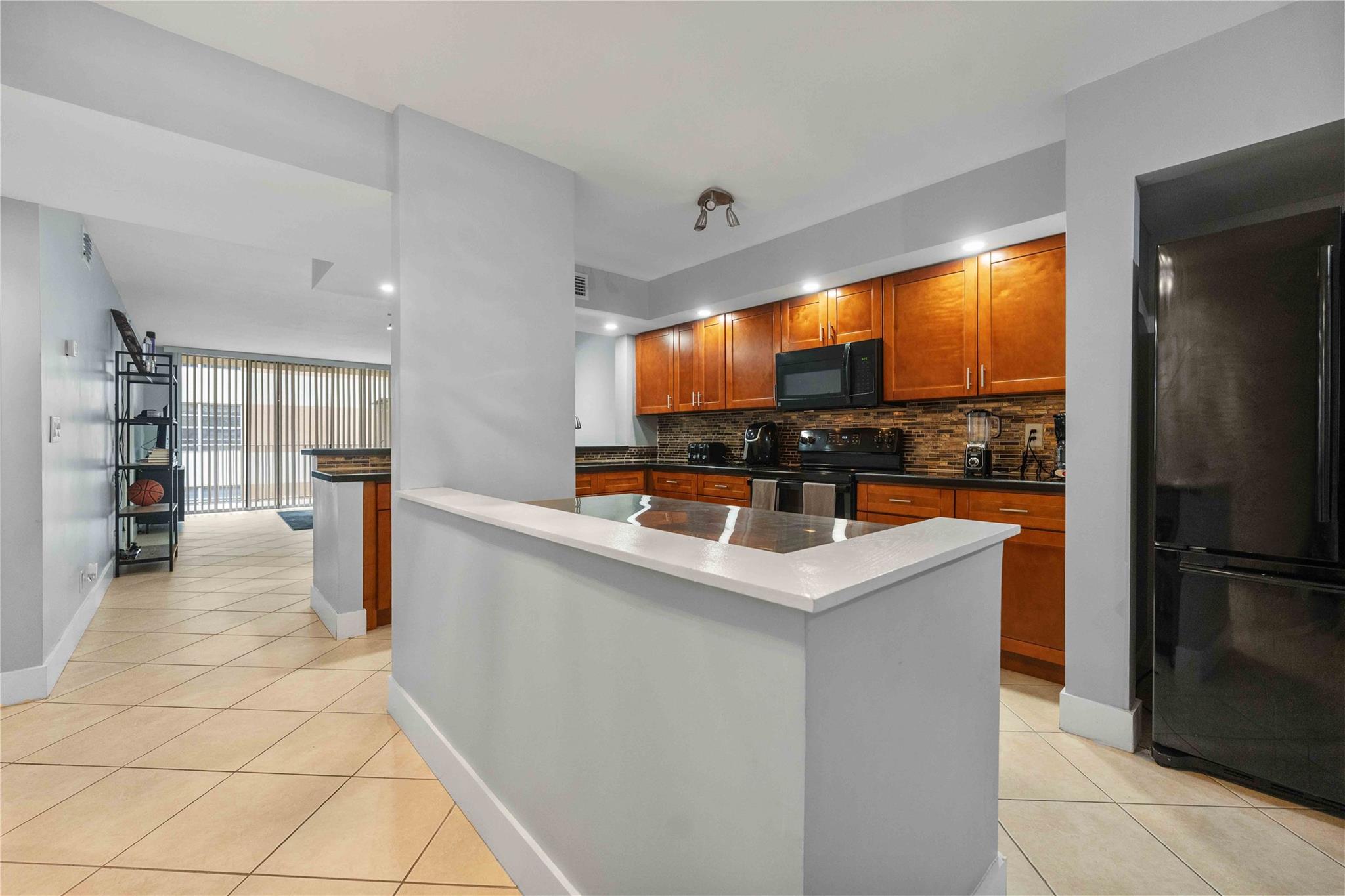 Rare opportunity! 3% DOWN PAYMENT!!! NEWLY REMODELED BATHROOMS + UPDATED KITCHEN + RENT IMMEDIATELY. Nestled in the heart of Coral Springs, this delightful 2-bedroom, 2-bathroom spans 1,140 square feet of well-designed living space. Featuring a NEW AC, walk in closets, The eat-in kitchen seamlessly flows into the living area, leading to a private balcony where you can enjoy the refreshing Florida breeze. With a pool, in-unit laundry, and plenty of GUEST PARKING, this low rise condo truly checks all the boxes for comfortable living and smart investing! Priced to sell, bring all your offers!!