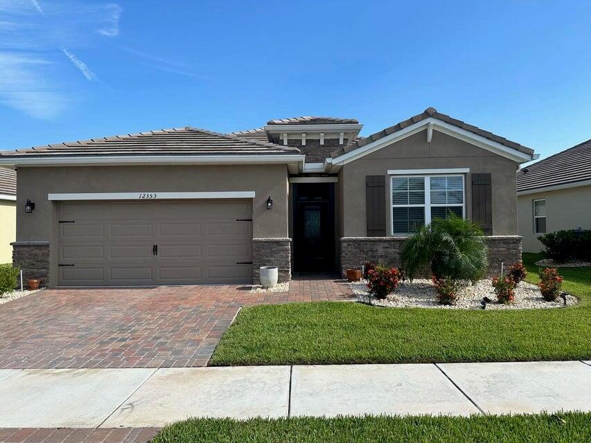 Sunrises & Sunsets on the lake are the views you'll cherish every day from your screened lanai. This 4-bed, 2-bath 2021 DR Horton home with upgrades galore including tile flooring throughout, crown molding, copper sink and faucet, upgraded appliances including double oven stove, ceiling fans just to name a few. It is truly a gem to see. Remote sheer shades on the slider door provide a softness within. To top it off this is a gated community for added security. Basic Cable and Internet provided by HOA. Experience all that Tradition has to offer from great amenities to local medical care, to some of the best shopping and restaurants around. Seller open to owner financing or rent with option to purchase.