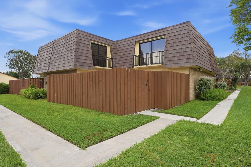 Spacious and rarely available 2 bedroom 2 bath.The HOA includes a master insurance policy and combined with the newer roof and storm protection helps keep residence offering 1540 square feet one of the largest floor plans in the community. This well located home features new wood plank flooring upstairs a 2 year old roof, mansard shingles and a 2023 AC package unit. Enjoy outdoor living in your private fenced courtyard perfect for entertaining grilling or relaxing. Complete hurricane impact shutters provide additional protection and insurance benefits.  Perfectly situated directly across from the clubhouse gym pool pickleball and tennis courts this home offers both convenience and lifestyle. Centrally located near schools, parks, shopping, dining, Airports and beautiful beaches. The HOA includes a master insurance policy and combined with the newer roof and storm protection helps keep HO6 insurance costs low. More Pictures to follow