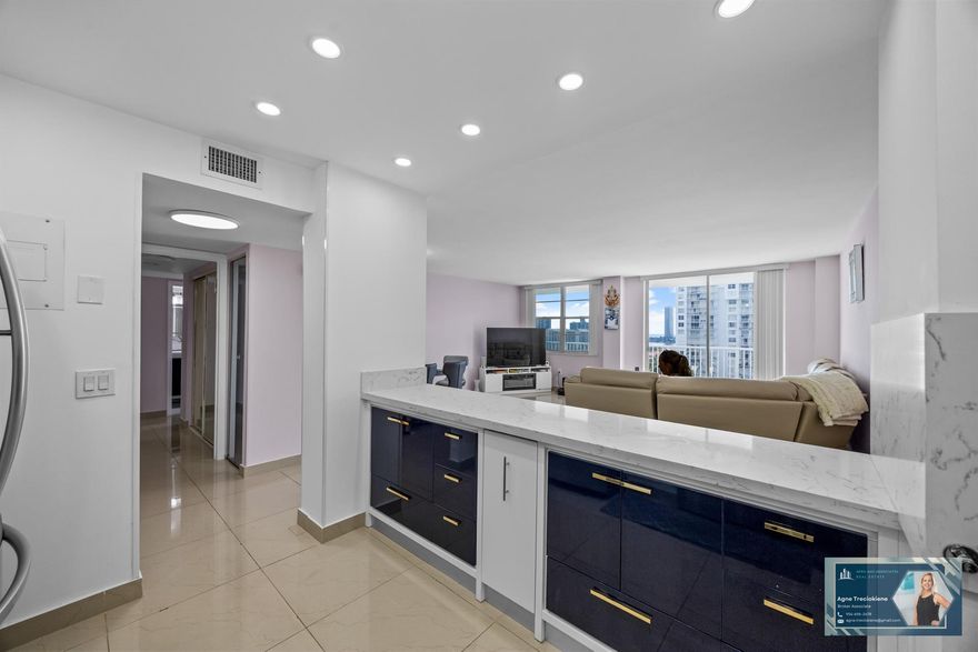 Beautifully renovated 2BD/2BA condo at Admirals Port in Aventura! Spacious split layout with open kitchen, quartz countertops, stainless steel appliances, updated bathrooms, tile floors, walk-in closets & ample storage. Enjoy serene Maule Lake views & sunsets from your huge balcony. New Bosch A/C (2022). New roof 2024. 40-yr cert completed and special assessment is paid already. HOA includes cable and internet. Resort-style amenities: 2 pools, gym, sauna, tennis, basketball, billiards, library, picnic areas, 24/7 security & assigned covered parking with many available guest spaces. Prime location near Aventura Mall, beaches, dining, parks & A-rated schools.