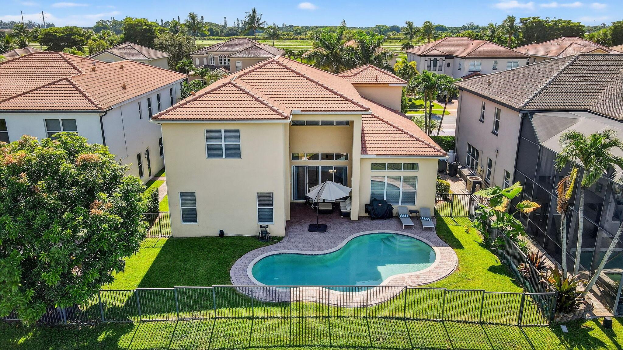 Stunning lakefront pool home in gated community! Spacious 5-bedroom, 4-bath, master downstairs layout features, well-appointed kitchen opens to living spaces, perfect for entertaining or everyday comfort. The primary suite features lake views, and a luxurious ensuite bath with dual vanities, walk-in shower & soaking tub. Upstairs features 4 bedrooms, 3 bathrooms and an open loft area, plenty of space for family or guests. Enjoy outdoor living at its best on the covered patio with tranquil views of pool and lake. Located near top-rated schools, shopping, dining, and Bethesda West Hospital. Minutes to Wellington and the turnpike. Hotwire cable & fiber internet included. Resort style clubhouse w/pool, billiards, aqua water park and fitness center.