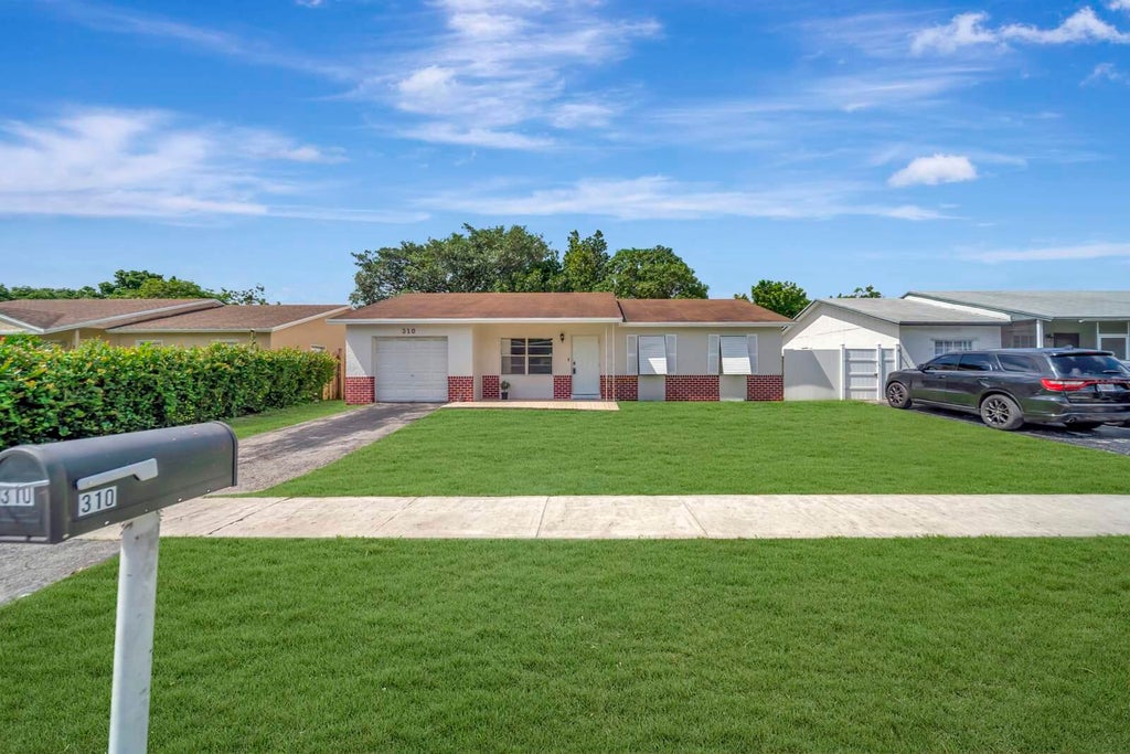 Photo of 310 SW 78TH Terrace, North Lauderdale, FL 33068 (MLS # B26085564)