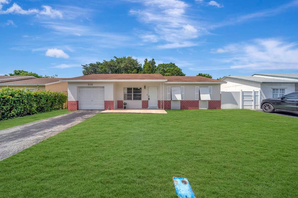 Photo of 310 SW 78TH Terrace, North Lauderdale, FL 33068 (MLS # B26085564)
