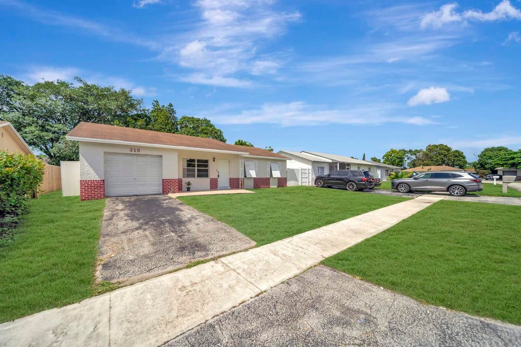 Photo of 310 SW 78TH Terrace, North Lauderdale, FL 33068 (MLS # B26085564)