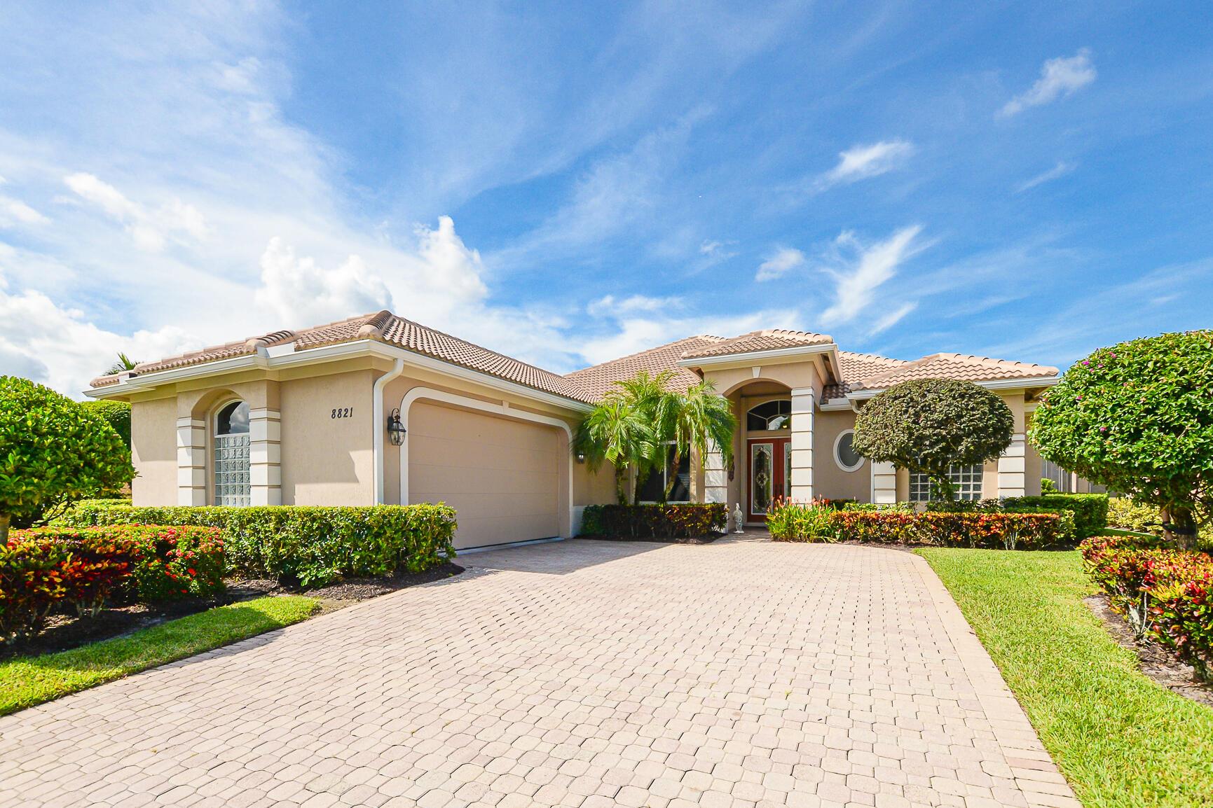 Beautiful Pool home on the Lake at ''Kingsmill'' in ''PGA Village''. Boasting NEW Barrel tile ROOF in 2025 & gutters. Features CBS Construction, 2 BR's, Den/Office with custom built-in's which can be used as a closet, 2.5 BA's, spacious Laundry room & oversized 2 CG w/ storage shelves. Enter into French Glass front doors, volume ceilings, crown molding, tile flooring with a stunning lake & pool views. Gorgeous re-designed updated kitchen w/ LG Island, eat in area, stainless steel appliances, quartz counters, wine cooler, coffee bar & French doors out to the lanai. Split floor plan with spacious Master Suite, laminate flooring & Re-done lovely Master bath. Screened enclosed lanai includes summer kitchen, heated pool/spa, updated pool pump & heater. Accordion shutters, hurricane & panels.