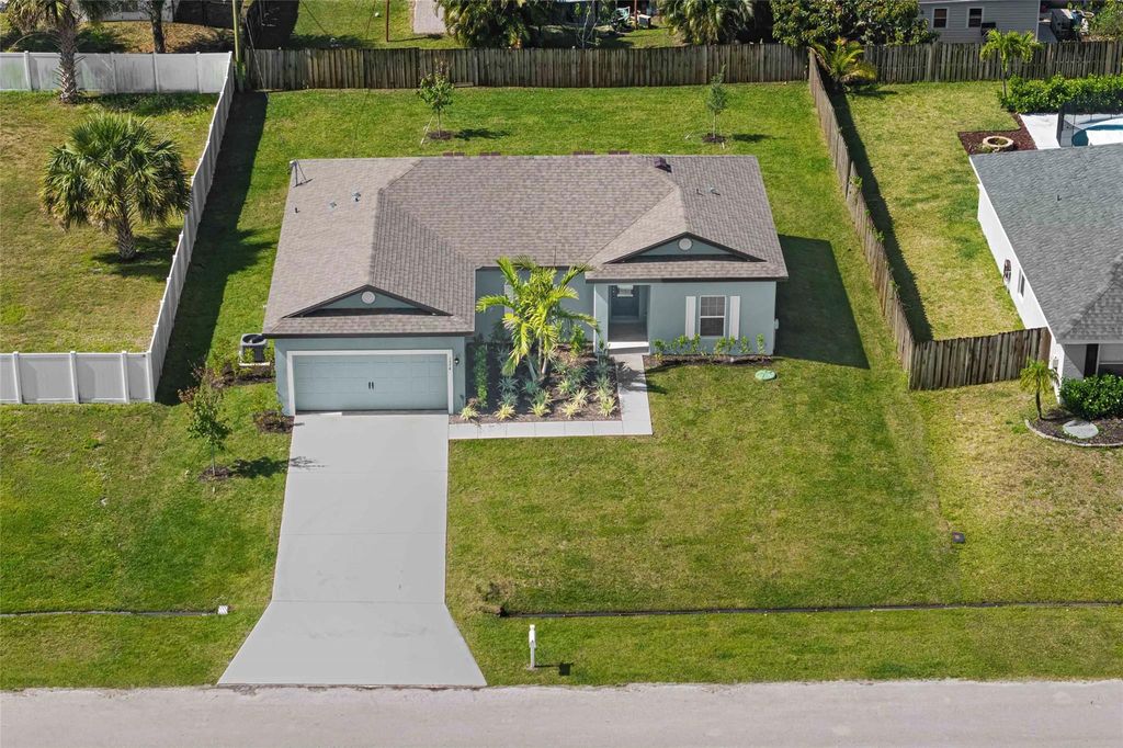 Photo of 1574 SW Leisure Lane, Port Saint Lucie, FL 34953 (MLS # F10476099)