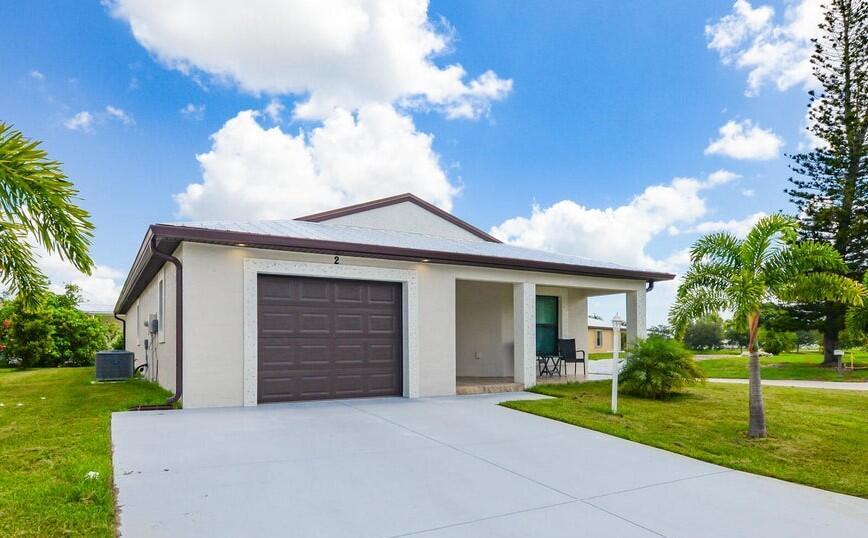 Welcome to this beautifully maintained 2022 CBS home located in a desirable 55+ community corner lot. This 2-bedroom, 2-bathroom residence features a 1-car garage with additional space for storage and offers the perfect blend of modern, comfort and style. Enjoy peace of mind with impact windows and a durable metal roof, along with elegant granite countertops, gutters, and high-quality finishes throughout. Situated on leased land, the community offers exceptional value with a monthly fee that covers lawn maintenance, access to resort-style amenities, and a scenic golf course. Embrace the Florida lifestyle in this like-new, move-in-ready home designed for both relaxation and active living.