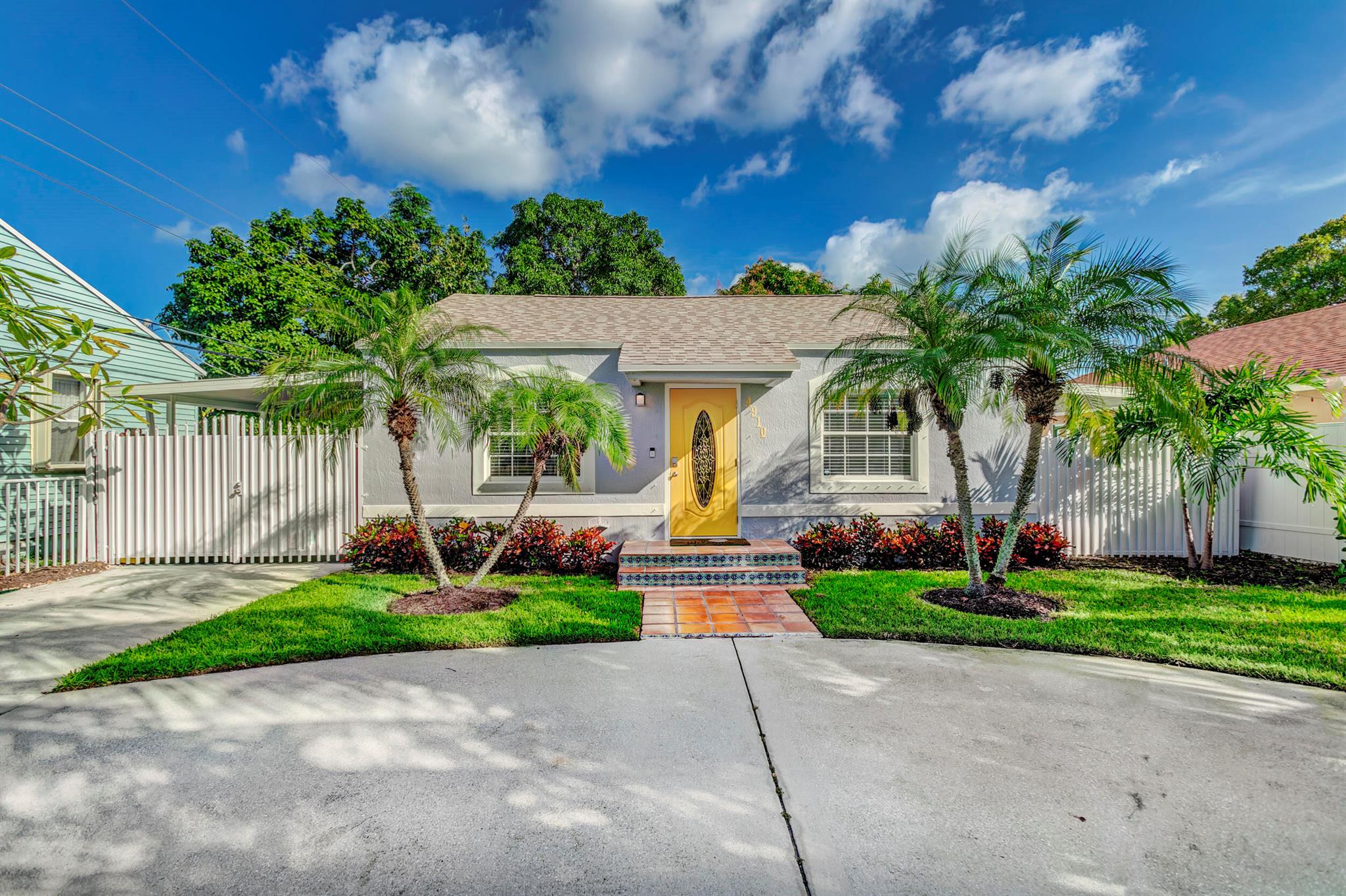Beautifully updated home in the heart of West Palm Beach! Just minutes from downtown, PBI airport, and the beach! This tastefully renovated home comes fully furnished. The kitchen offers granite countertops and stainless-steel appliances, as well as a built-in waterfall edge dining table. Brand new energy efficient A/C. Enjoy the large private, fully fenced backyard from the covered wraparound patio. The home has been freshly painted inside and out. Plenty of off street parking with a large circle driveway. Pest and Lawn care included! Schedule your showing today!