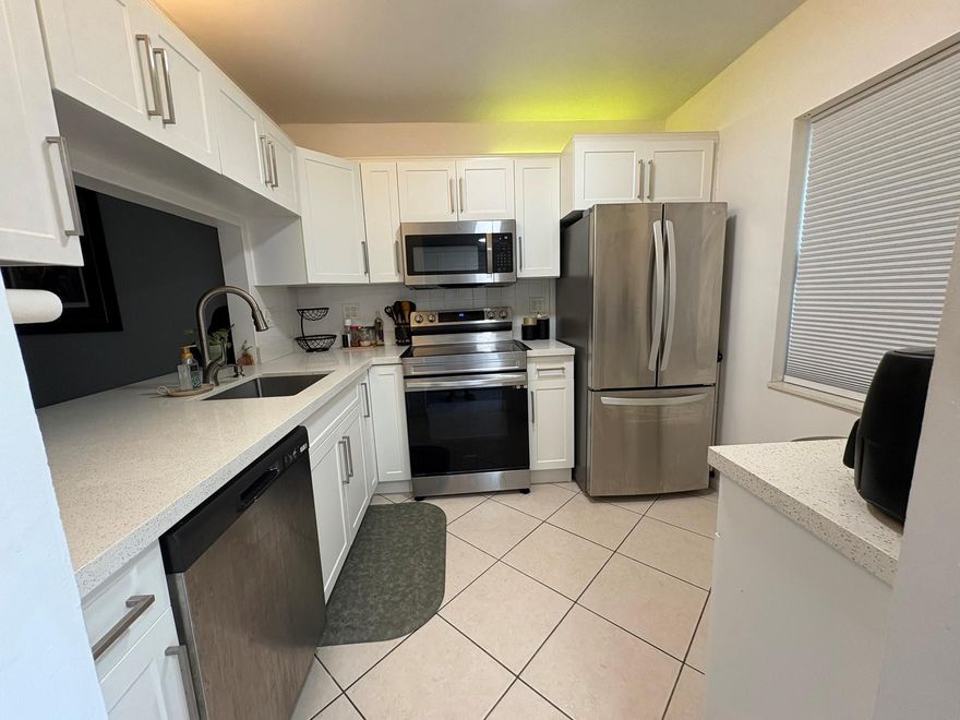 Move right into this updated 2nd floor corner in 55+ community with beautiful canal views.  Updated kitchen with quartz countertops, newer stainless-steel appliances.  Pantry.  2 updated en-suite bathrooms with walk-in showers.  Primary suite has walk-in closet.  Lots of storage.  Extra storage locker, basic cable, water sewer and trash included in maintenance.  Newer hot water heater.  Association requires 20% down, 700 credit score, $40K+ income and security deposit to be refunded after 18 months.