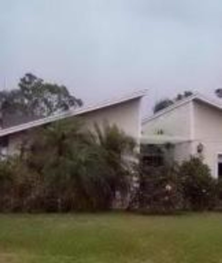 This 3 bedroom 2.5 bath home offers a spacious living room, a eat in kitchen that opens to the pool and patio area. The master bedroom host lots of windows for sunlight and on suite master bathroom. Close to shopping, schools, local beaches and the Florida Turnpike this property has it all. This is a homepath property.