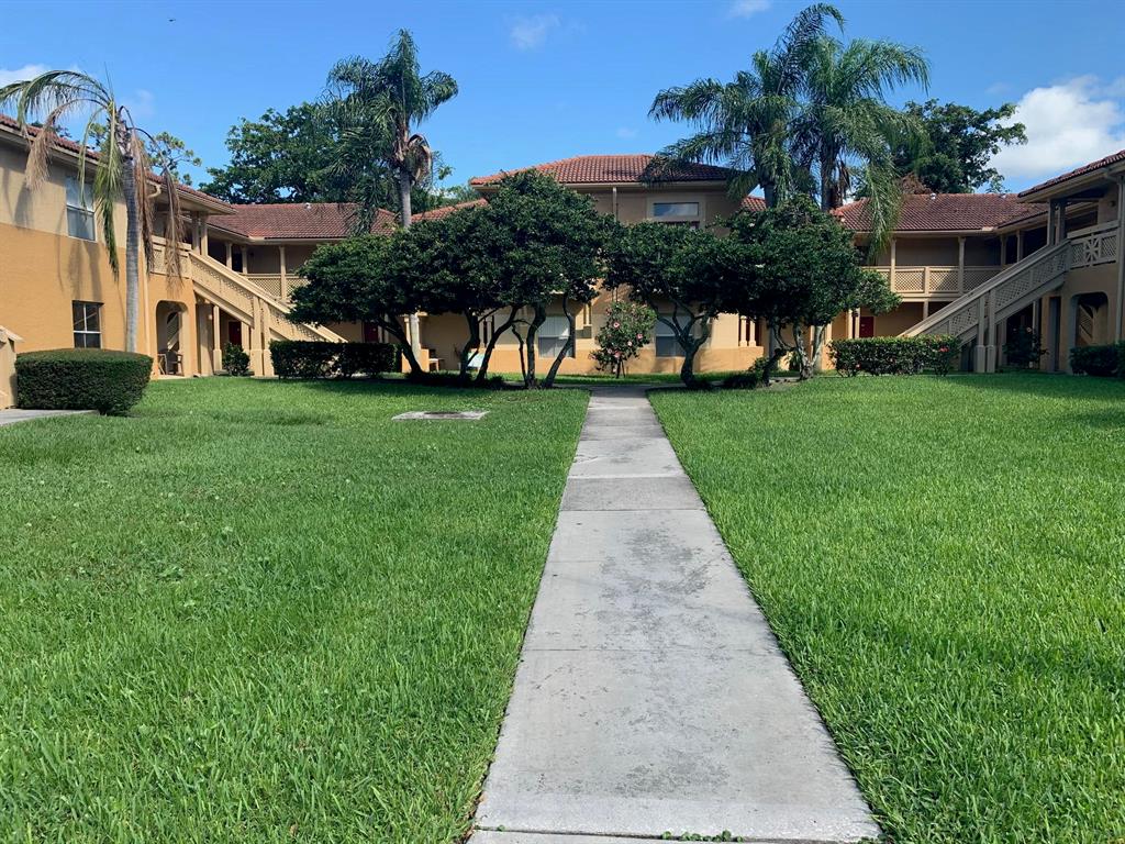 2/2 first floor condo in a central West Palm Beach gated community. Unit features new wood look vinyl flooring, washer dryer in unit, white kitchen, walk-in closets, and screened patio. Kitchen has a large pantry, ample storage and counter space, and bar seating. Community offers clubhouse, tennis courts, and community pool.