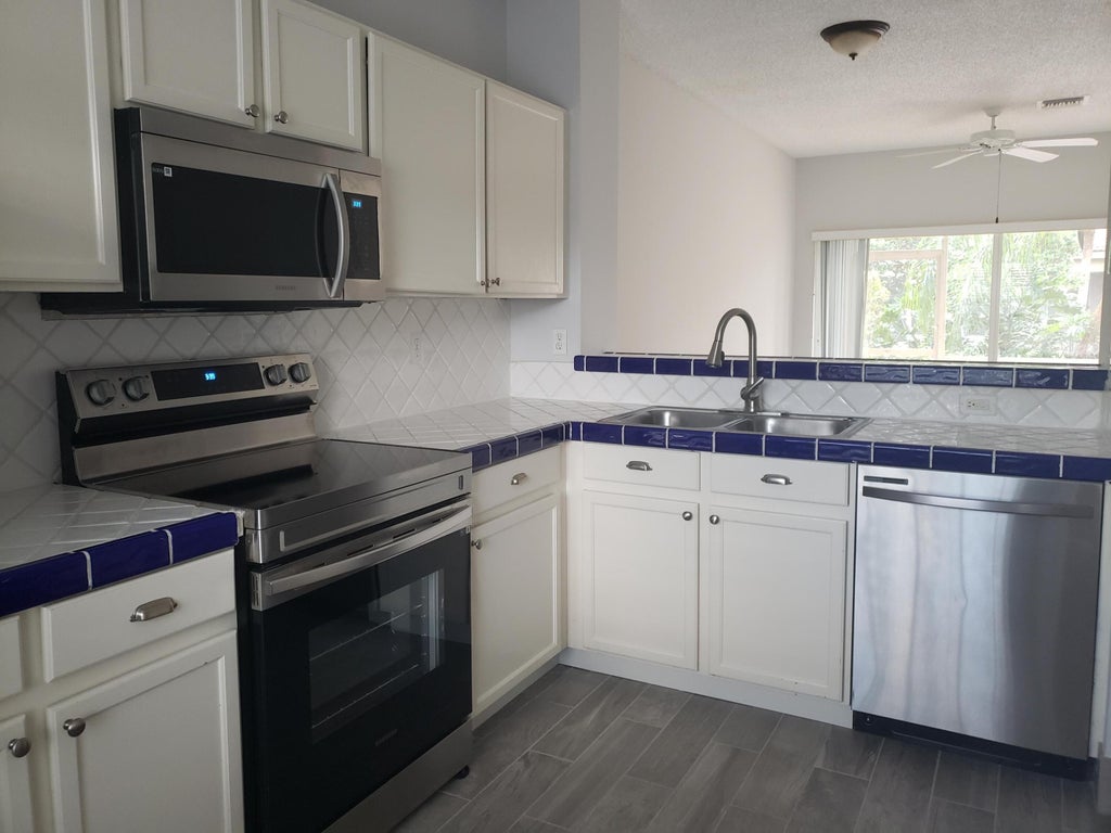 Photo of 6945 Stoney Creek Circle #6945, Lake Worth, FL 33467 (MLS # B26033015)