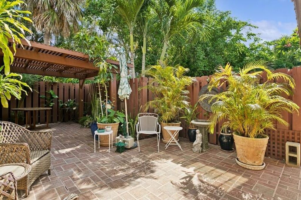 Photo of 7 Atrium Circle #D, Atlantis, FL 33462 (MLS # R11098885)