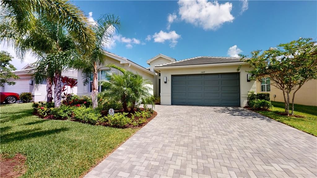 Photo of 11659 SW Sailfish Isles Way Way, Port Saint Lucie, FL 34987 (MLS # F10341420)