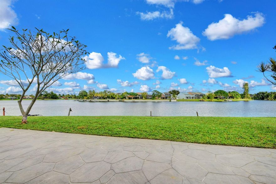 INCREDIBLE LAKE VIEWS WITH 100FT OF DIRECT CULDESAC WATERFRONT! NO CARPET! UPGRADED 3 BEDROOMS 2.5 BATH & 2 CAR GARAGE WITH HUGE PATIO & A VERY LONG DRIVEWAY ON AN OVERSIZED LOT. LIGHT, BRIGHT & AIRY WITH 3 SLIDING DOORS & ADDITIONAL WINDOWS TO APPRECIATE THE EXCEPTIONAL VIEW. TILE DOWNSTAIRS AND LAMINATE STAIRS, LOFT AND BEDROOMS, PLANTATION SHUTTERS, GOURMET KITCHEN INCLUDES UPGRADED WOOD CABINETS, GRANITE & STAINLESS APPLIANCES. SEPERATE LAUNDRY ROOM, UNDER STAIR STORAGE, PRIMARY BATH HAS GRANITE & LARGE TILE SHOWER & LARGE WALK IN CLOSET. WALK TO THE COMMUNITY POOL, SPA & FISHING PIER. LOCATED IN THE HEART OF WELLINGTON. A-RATED SCHOOLS. COME LIVE THE DREAM. ONCE YOU SEE THIS WATER VIEW YOU WON'T WANT TO LEAVE!