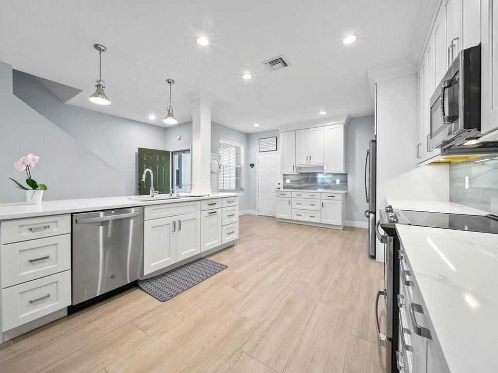 Photo of 1570 SE Sheffield Terrace #102, Stuart, FL 34994 (MLS # R10812685)