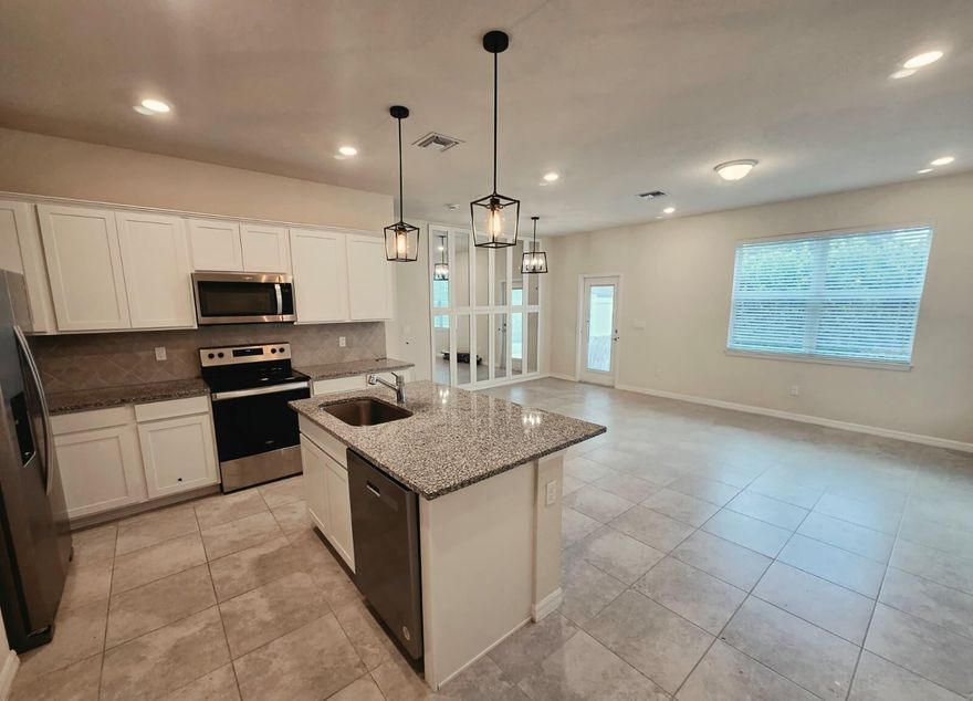 Welcome to a Newer 2023 Pulte construction townhouse in gated, family-friendly community! Features include impact windows throughout, offering enhanced safety, energy efficiency and storm protection.  Wi-Fi included with rent. EV charging outlet suitable for a Tesla or other electric vehicle, automatic one-car garage, 3 bedrooms, 2.5 baths, stainless steel appliances, and upstairs washer/dryer conveniently located next to bedrooms. Community playground, picnic area onsite. This modern home features impact windows Close to I-95, the Turnpike, downtown Fort Lauderdale, shopping, dining and the beaches. Perfectly combining modern comfort with an unbeatable location. HOA approval is required. One Pet allowed with additional pet deposit.
