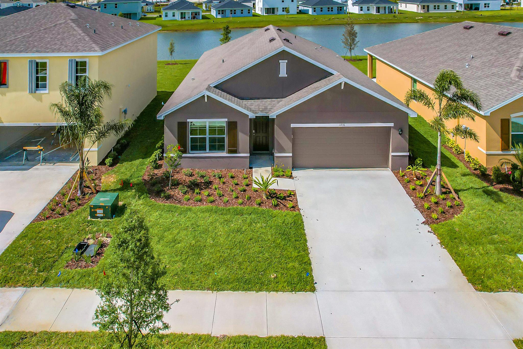 Welcome to this beautifully designed, single-story modern home built in 2022 with a full lake view. Showcasing an airy open-concept layout, it perfectly blends style and functionality for contemporary living. With 4 generously sized bedrooms, 2 elegant bathrooms, and a spacious 2-car garage, this home offers plenty of room for comfort and convenience.The heart of the home is the expansive family room, seamlessly connected to the kitchen -- an ideal space for everyday living, entertaining, and family gatherings. Large windows flood the interior with natural light, enhancing the bright and welcoming atmosphere. EV charger in the garage.Located in the sought-after Crosstown