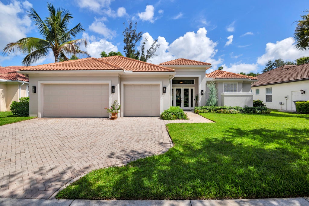 Photo of 1754 Flagler Manor Circle, West Palm Beach, FL 33411 (MLS # B26063676)