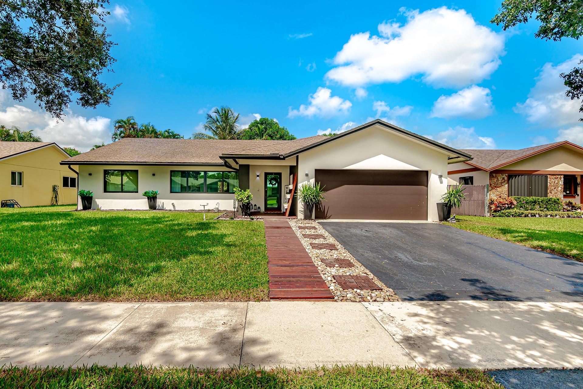 THIS "HOME SWEET HOME" IS A MUST SEE. AS SOON AS YOU ENTER THIS EXCEPTIONAL UPGRADED 3/2 POOL HOME YOU WILL FEEL LIKE YOU ARE HOME. PLENTY OF NATURAL LIGHT WITH AN OPEN FLOOR PLAN, INCLUDING VAULTED CEILINGS, SPACIOUS LIVING ROOM, DINING ROOM, AND FAMILY ROOM. UPDATED KITCHEN WITH 1-YEAR OLD APPLIANCES. NEW IMPACT WINDOWS & DOORS, NEW AC, TESLA CHARGER, SMART HOME EQUIPMENT, AND TOO MUCH MORE TO MENTION. ENTERTAIN WITH PRIDE IN THE RESORT STYLE POOL AND PATIO, EQUIPPED WITH OUTDOOR KITCHEN. POOL IS BOTH HEATED & CHILLED, AND SELF CHLORINATES.
LOCATED IN THE HEART OF THE HIGHLY DESIRABLE FLAMINGO GARDENS IN COOPER CITY, ON A VERY QUIET TREE LINED STREET, THE NEIGHBORHOOD IS EXCELLENT, AND THE SCHOOLS ARE BETTER. NO HOA FEES!!! ******THIS ONE WILL NOT LAST******