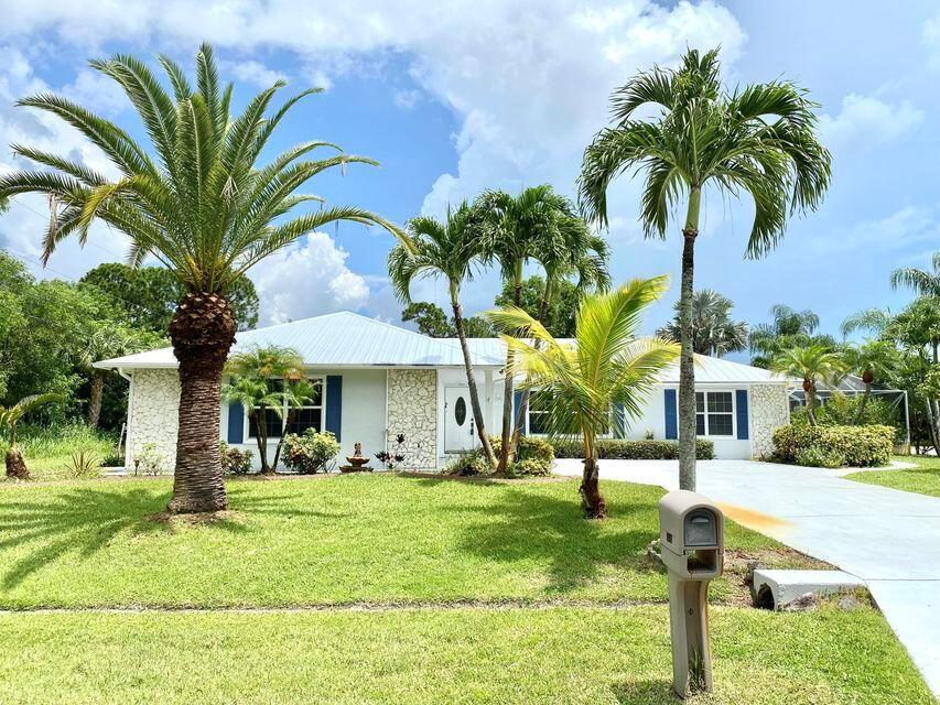 Welcome to this tropical 3-bedroom, 2.5-bath pool home with a 2-car garage, perfectly situated on a large corner lot. POOL AND LAWN SERVICE IS INCLUDED IN RENT!! This home offers generous living space including a formal living room, formal dining room, and a bright family room. The eat-in kitchen features granite countertops, a breakfast bar, and ample cabinet space--ideal for both cooking and entertaining. All bedrooms are generously sized, and the home includes a large utility room complete with washer and dryer. Enjoy Florida living at its best in the expansive Florida room and the screened-in pool area with a covered patio--perfect for relaxing or hosting guests year-round. Additional highlights include a newer metal roof and a brand-new air conditioning system for peace of mind.