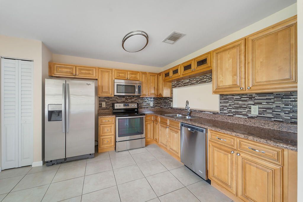 Photo of 189 Raintree Trail, Jupiter, FL 33458 (MLS # R10931338)