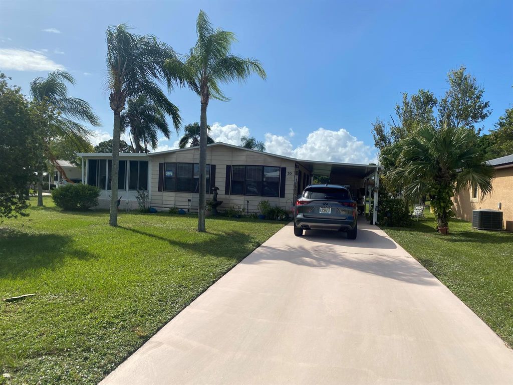 Photo of 50 La Puerta Del Norte, Fort Pierce, FL 34951 (MLS # R10930583)