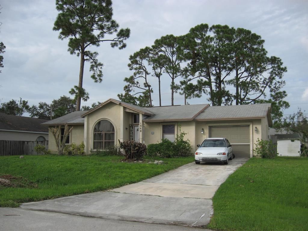Photo of 1549 SW Leisure Lane, Port Saint Lucie, FL 34953 (MLS # R10726640)