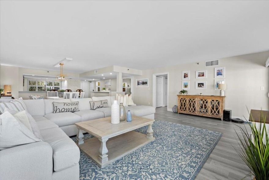 This custom, fully renovated 3 bd, 2 ba condo in the highly sought-after Everglades of North Palm Beach offers 1978 sq ft of luxurious waterfront living. Offered fully furnished and turn key, every detail has been thoughtfully selected. The gourmet kitchen features stainless steel appliances, quartz countertops, and a farmhouse sink. Plantation shutters adorn every window for a seamless coastal look. The primary bedroom impresses with spectacular water views from every window, even the ensuite shower. Three closets in the suite, including a walk-in with custom built-ins, offer ample storage. Enjoy sunset views from your private, west-facing balcony. Resort-style amenities include waterfront pool, tennis courts, and swim steps to the Intracoastal waterway. 2024 Roof. Milestone Complete