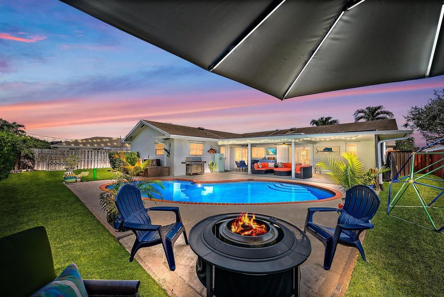 Experience the ideal blend of Florida elegance and Serena & Lily-inspired design in this light & airy Palm Beach Gardens CBS home. Featuring designer finishes throughout, this residence exudes modern sophistication & comfort with sleek, modern details such as 36'' porcelain flooring (2024), crown molding,  Impact glass, new interior/exterior paint, 2024 professionally designed bathroom renovations & a 2024 customized resort-style entertainment area -- featuring an expansive covered patio, large heated saltwater pool, lush turf backyard, and plenty of space for soccer, a garden party or a backyard BBQ. Perfect for family fun or relaxed Florida evenings with friends.  (see more)