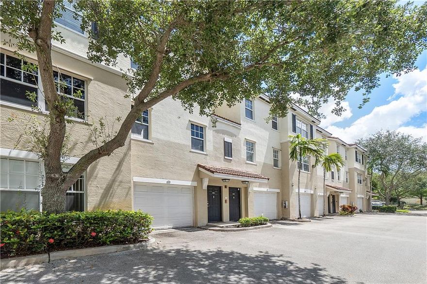Don't miss this well-maintained rarely available 2 bed, 2 bath with garage in gated Poinciana Place! This home has been updated with new appliances, laminate flooring throughout, and beautiful open shelving in the kitchen. The clubhouse includes resort style amenities such as a large swimming pool, hot tub, BBQ area, gym, and a party room for entertaining! Conveniently located and walking distance to many restaurants and shops. The association includes water, basic cable, internet, clubhouse and roof repairs. Easy to show!
