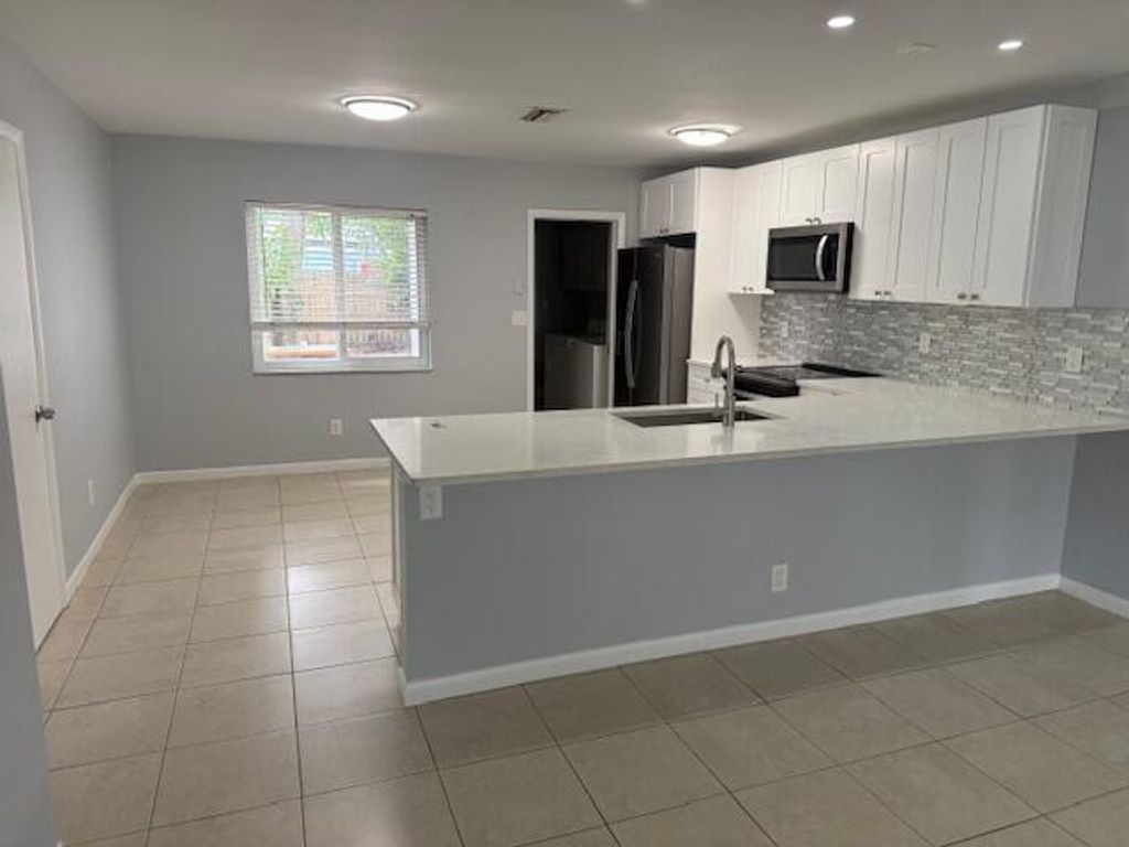 Photo of 240 NW 41st Court, Deerfield Beach, FL 33064 (MLS # R11126493)