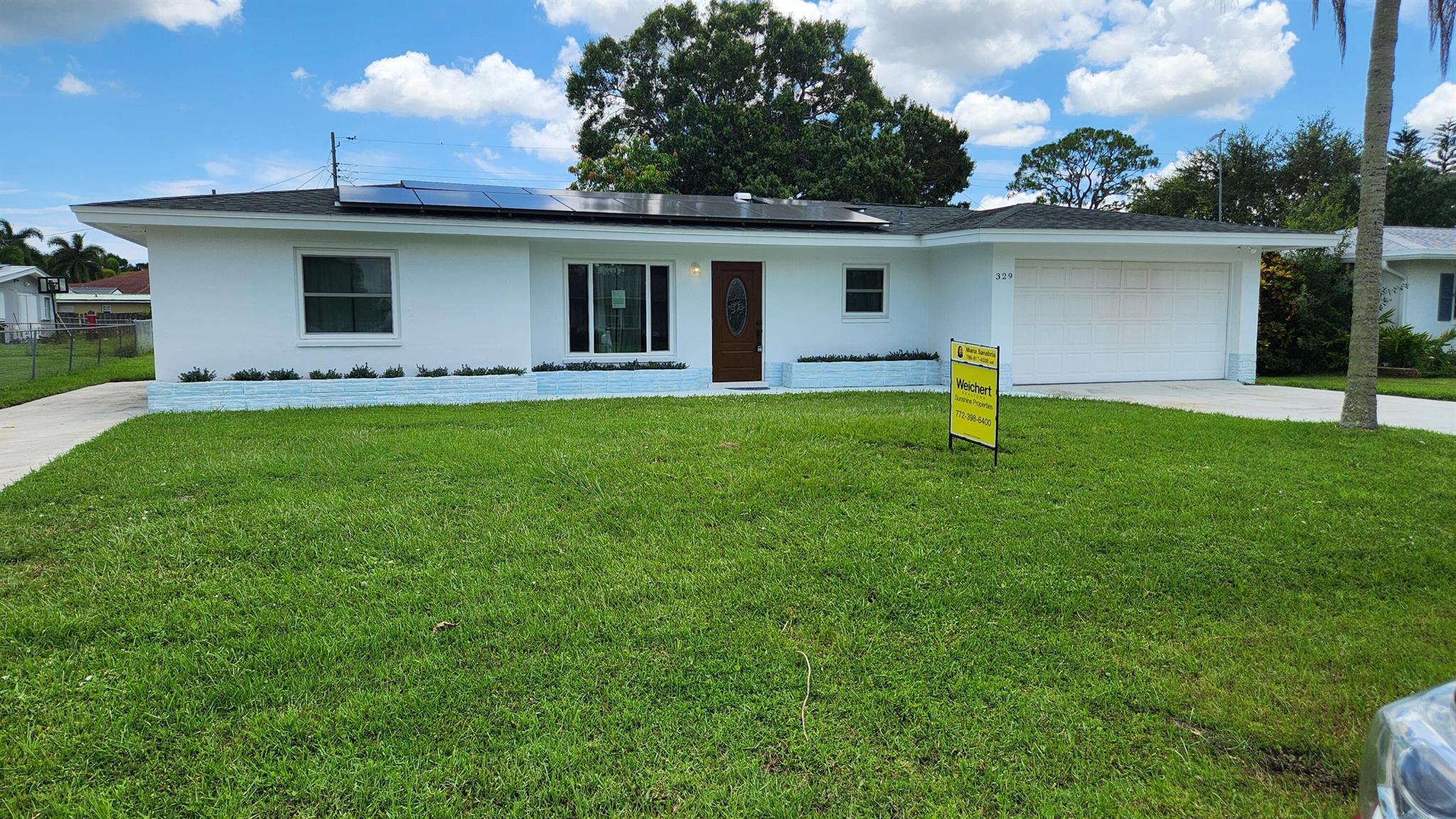 Move-in ready and full of upgrades! This well-maintained 3-bedroom, 2-bath home features a 2022 roof, impact windows throughout the front of home and double panel in back and solar panels that will be paid off at closing--bringing long-term energy savings! Enjoy the convenience of two separate driveways and a spacious 2-car garage, perfect for extra vehicles, boats, or guests. Located in the desirable River Park neighborhood with no HOA and easy access to US-1, shopping, dining, and beaches. A fantastic opportunity to own a solid, energy-efficient home in Port St. Lucie!