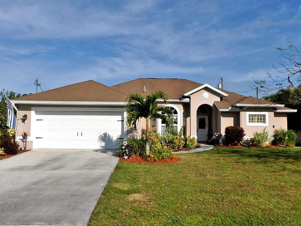 Photo of 1509 SW Crater Avenue, Port Saint Lucie, FL 34953 (MLS # R10827705)