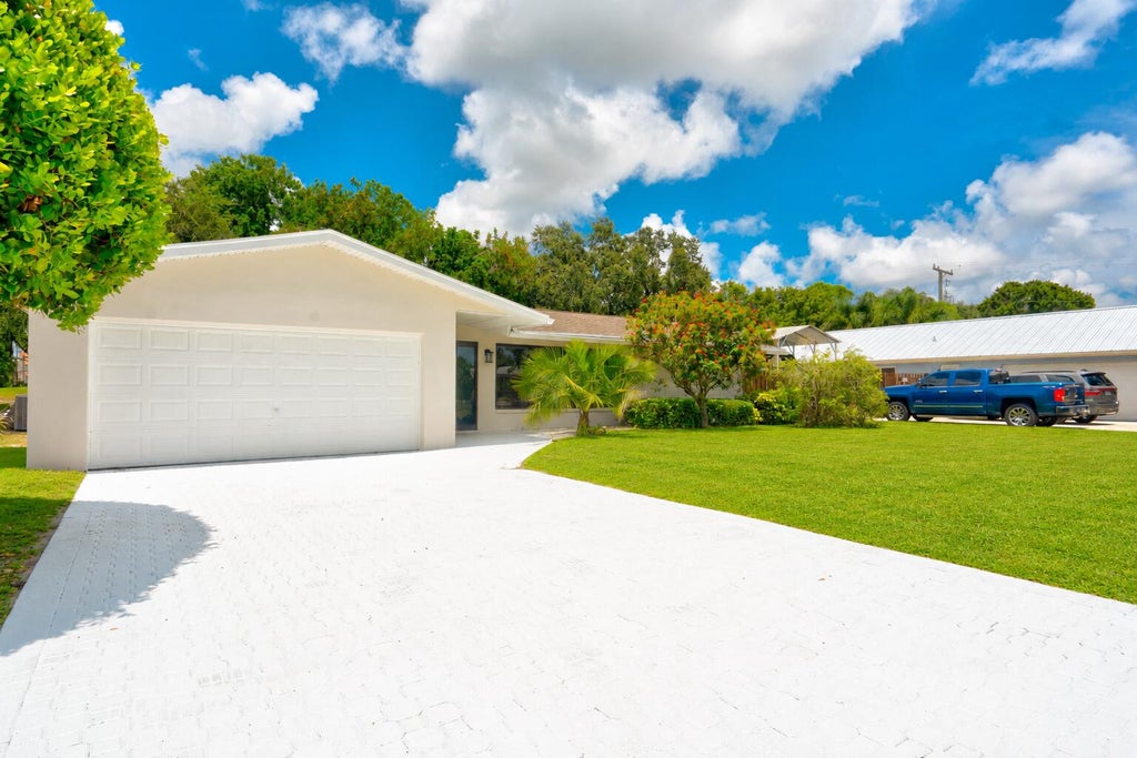 Photo of 7715 SAINT ANDREWS Road, Lake Worth, FL 33467 (MLS # B26058306)