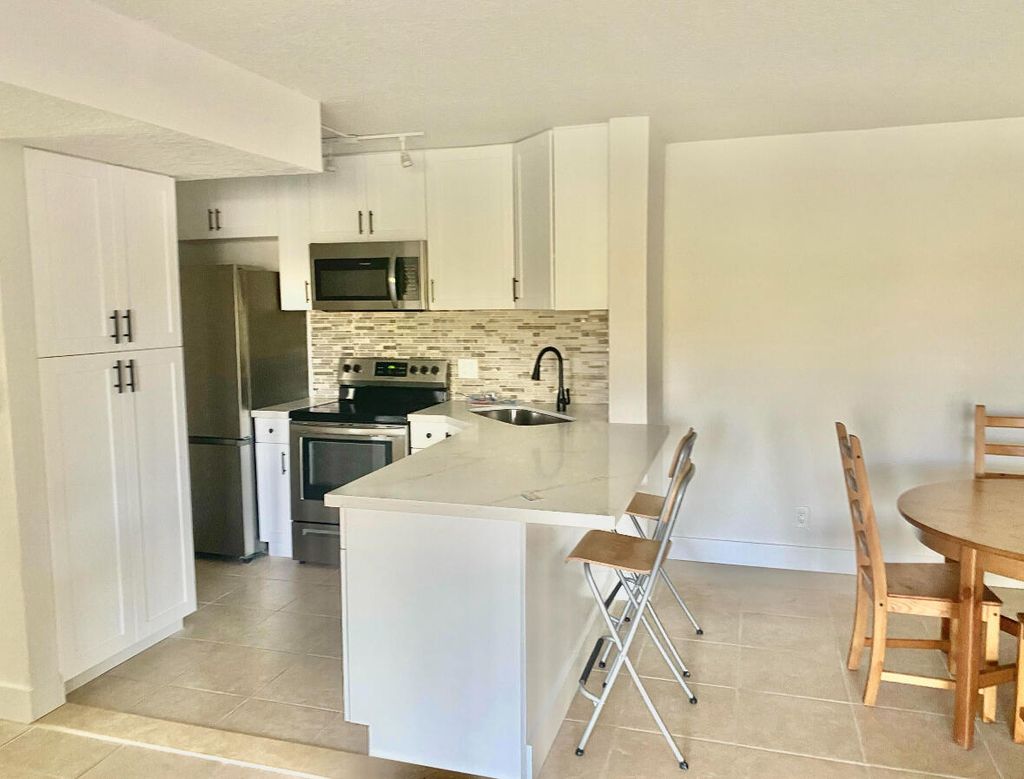 Photo of 629 Sea Pine Way #A1, Greenacres, FL 33415 (MLS # B26009000)