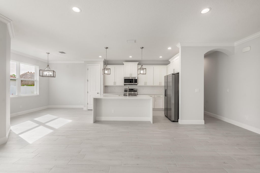 Photo of 1102 SW Hunnicut Avenue, Port Saint Lucie, FL 34953 (MLS # R10985795)