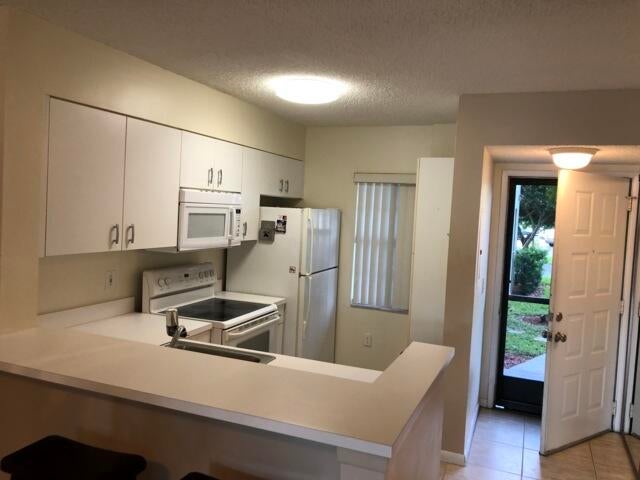 Photo of 2236 N CYPRESS BEND Drive #106, Pompano Beach, FL 33069 (MLS # B26066536)
