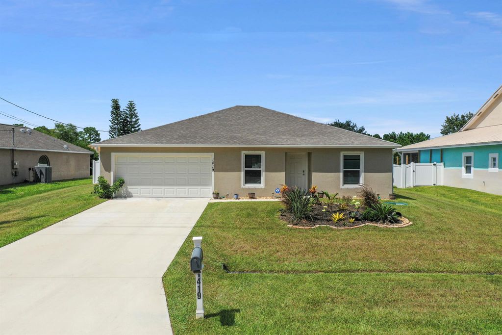 Photo of 1419 SW Gadsan Avenue, Port St Lucie, FL 34953 (MLS # R10917251)