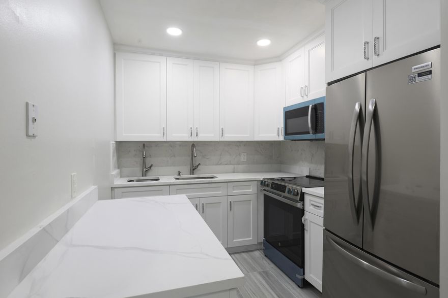 THIS STUNNING 2 BEDROOM 1.5 BATH 2nd FLOOR CONDO LOCATED IN CENTURY VILLAGE A GATED COMMUNITY  FOR ACTIVE ADULTS 55+ IS READY FOR YOU TO MOVE IN. LIGHT AND BRIGHT AND UPDATED.. THE KITCHEN FEATURES WHITE CABINETS, BRAND NEW STAINLESS STEEL APPLIANCES 2 SEPARATE SINKS AND RECESSED LIGHTING LIVING ROOM HAS RECESSED LIGHTING, UPDATED BATHROOMS. CENTRAL AIR CONDITIONING GUEST ROOM HAS A MURPHY BED .LUXURIOUS FLOORING THROUGHOUT. Roomy closets (one walk-in), screened-in patio, laundry room, assigned parking spot plus visitor parking available; local bus for errands/shopping both within & outside The Village;  CONDO NEXT DOOR IS ALSO FOR SALE .  WELL MANAGED ASSOCIATION. BUILDING HAS NEW ROOF. STEPS TO THE HASTINGS FITNESS CENTER WHICH HAS RESISTANCE POOL, SWIMMING. POOL , SAUNA AND GYM. COME &  ENJOY RESORT STYLE LIVING IN THIS ACTIVE 55 +COMMUNITY.  CLUBHOUSE features a theater, indoor pool, card room, community/party room, billiard room ,shuffle board ,tennis , pickqleball ,bocce and two outdoor pools. Numerous heated outdoor pools throughout the community. Separate fitness center with gym , outdoor heated pool and a resistance pool. Two guarded gates and 24 hour roving security patrol. GREAT LOCATION: close to shops, restaurants, PBI airport and beaches