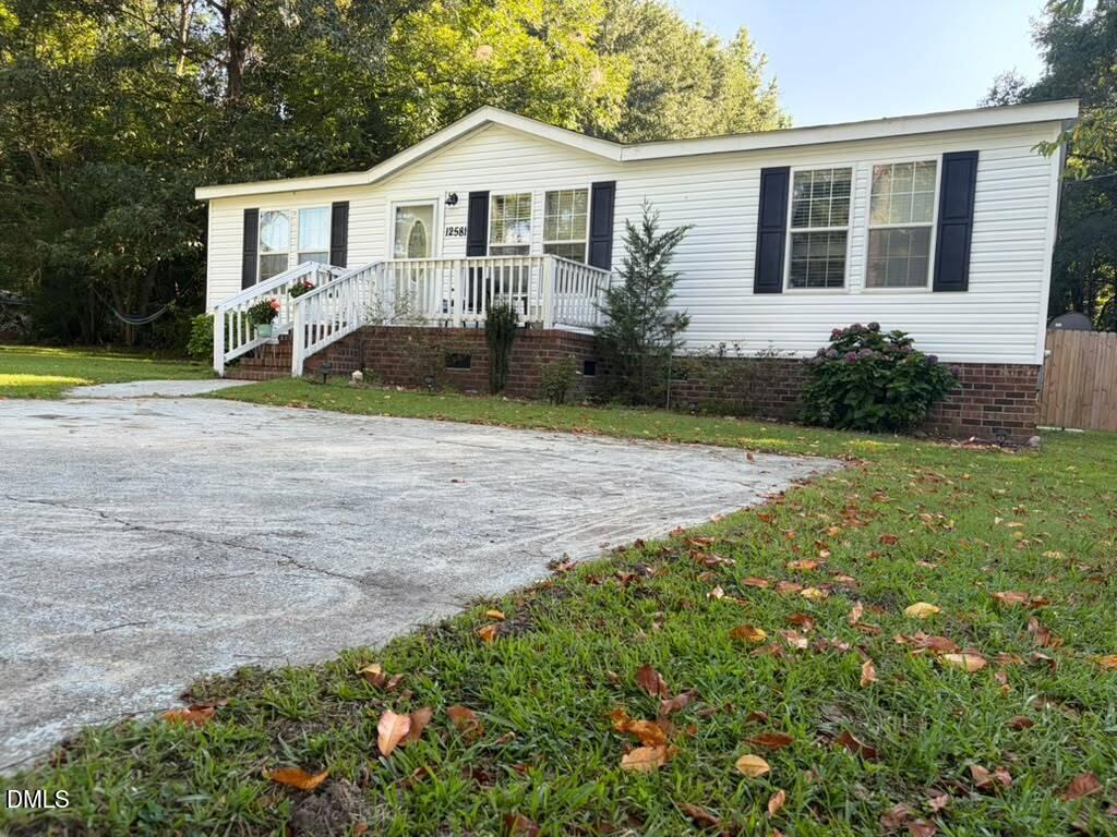 Photo of 12581 South Street, Whitakers, NC 27891 (MLS # 10192386)
