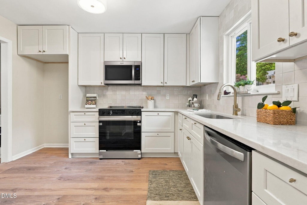 Photo of 4658 Grinding Stone Drive, Raleigh, NC 27604 (MLS # 10192476)