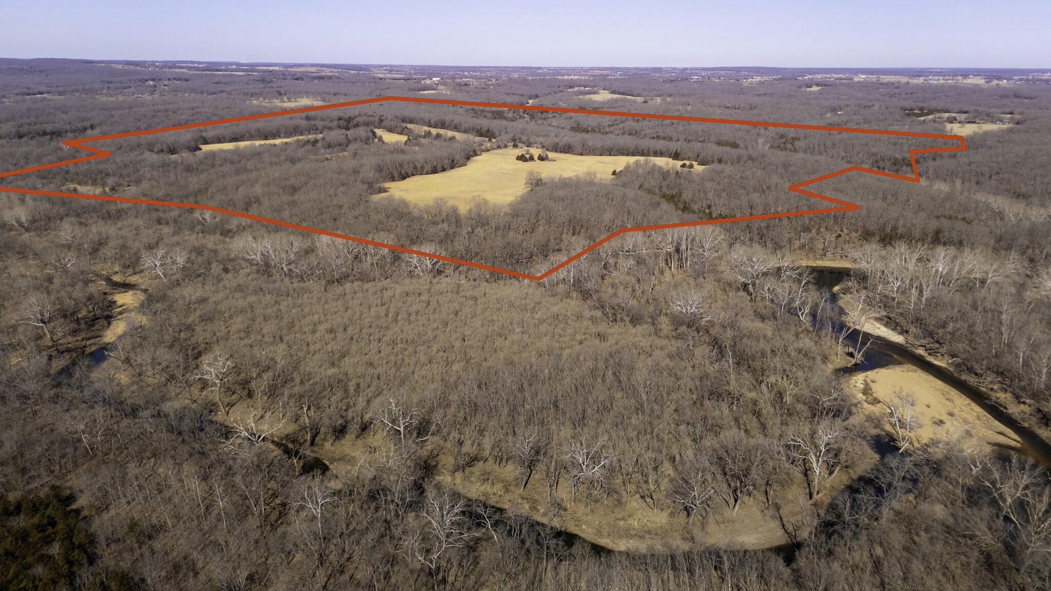 This 299.75+/- acres is conveniently located roughly 12 miles North of Bolivar on Hwy 83. This great hunting and cattle property has privacy and is secluded from other residential properties. Two ponds provide water for animals. Situated adjoining the Pomme de Terre River and Dry Fork wet weather creek. Cave along the bluffs. Several cleared and level areas perfect for building your dream cabin or home. Property is approx. 60% wooded and 40% cleared and pasture. There are multiple trails through the woods for great hunting.  Property includes a old well and used to have electricity service. Neighboring to the south and east is land area owned by the U.S Government Corp of Engineers as part of the Pomme De Terre River.