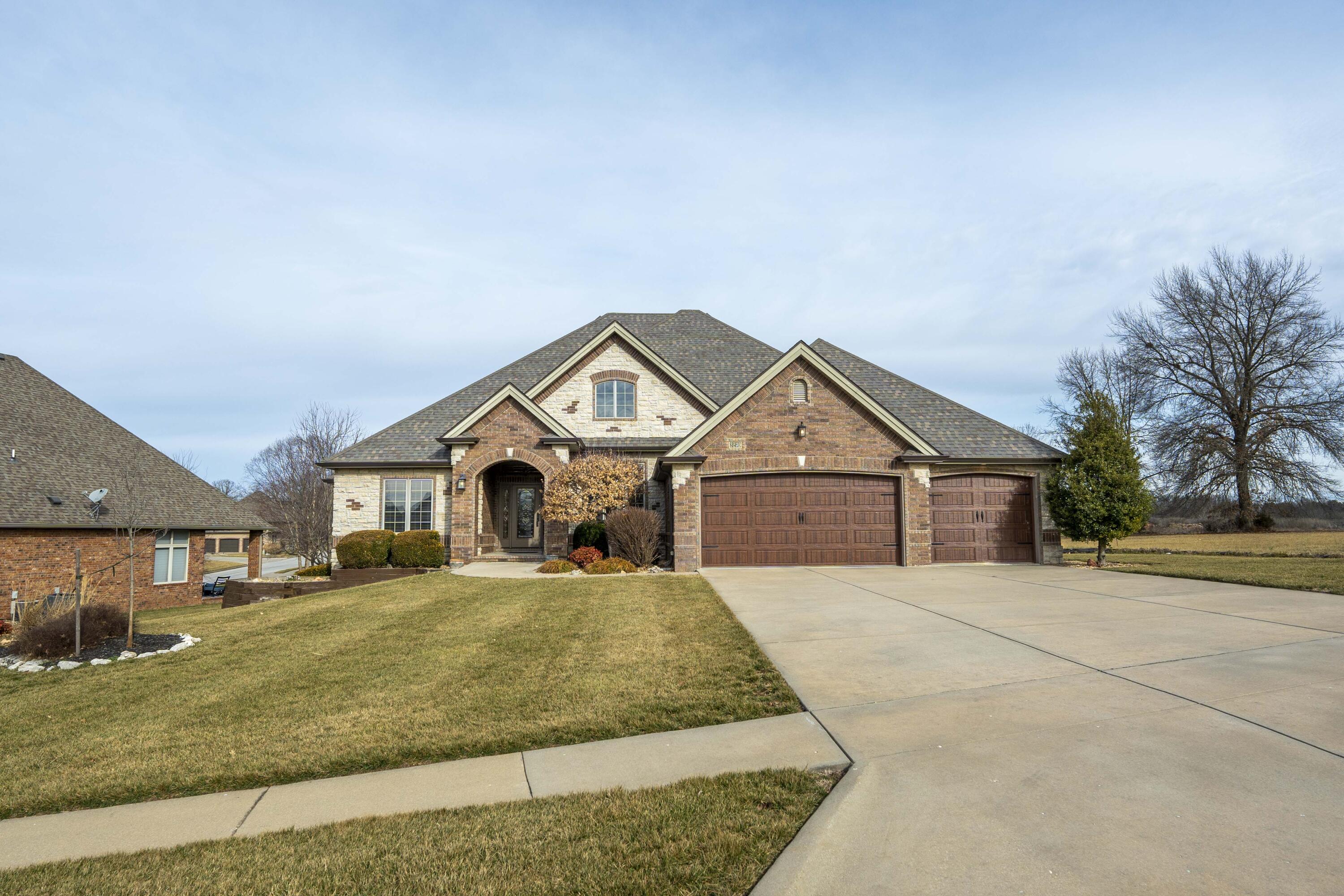Welcome to 3279 W Ridge Run, a beautifully maintained 4-bed, 2.5-bath all-brick and stone home nestled at the end of a quiet dead-end street in the sought-after Rivercut neighborhood. This home has tons of extras and offers peaceful views and an abundance of wildlife, including deer and turkey, creating a serene retreat right in your backyard. The backyard has been professionally landscaped adding a pleasing aesthetic and low maintenance appeal.Inside, you'll find two inviting living areas. Enjoy a formal living room with tray ceilings and a gorgeous fireplace with matching custom built-in bookcases. It also includes a second living space, a cozy hearth room open to the kitchen area with a fireplace, perfect for relaxing evenings. The formal dining room provides an elegant space for entertaining. The kitchen has abundant cabinets and features a great island with bar seating, perfect for entertaining. The spacious master suite is a true retreat, featuring a newly enlarged tile shower and a huge walk-in closet. The fourth bedroom is currently used as a home office, offering flexibility for your needs.Step outside and enjoy the fantastic outdoor spaces, ideal for morning coffee, summer BBQs, or simply unwinding in nature.  The 500 sq. ft. partial basement offers endless possibilities--it's perfect for a workshop, John Deere room, game room, or extra storage.This immaculately cared-for home is located in the prestigious Rivercut community, home to the Rivercut Golf Course, a neighborhood pool, clubhouse, and more! With its peaceful setting, gorgeous views, and top-tier amenities, this home is a rare find.Don't miss your chance to experience the beauty and comfort of this exceptional property--schedule a tour today!