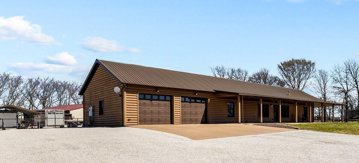 3 BR 3 BA log home on 45 acres on the edge of Monett. Beautiful panoramic views overlooking an acre pond. Home has open floor plan solid surface counter tops, master suite with large walk in closet that's every woman's dream, stand up shower and bath tub, motion lighting under the vanity. In the living room there's room for 2nd living space, pellet stove . Kitchen has lots of storage solid wood cabinetry, kitchen bar and room for large kitchen table all with modern  design . Pipe fence surround the home with gates in front and back. 40x60 spray insulated, concrete floor, barn with lean-to on both ends and a piped working corral has head shoot and scales set up for your show animals. field is cross fenced with water in each paddock. 2 ponds that have been stocked with fish.  This property has both the land your looking for and a beautiful home. and storm shelter . Home provides natural gas, Private well,