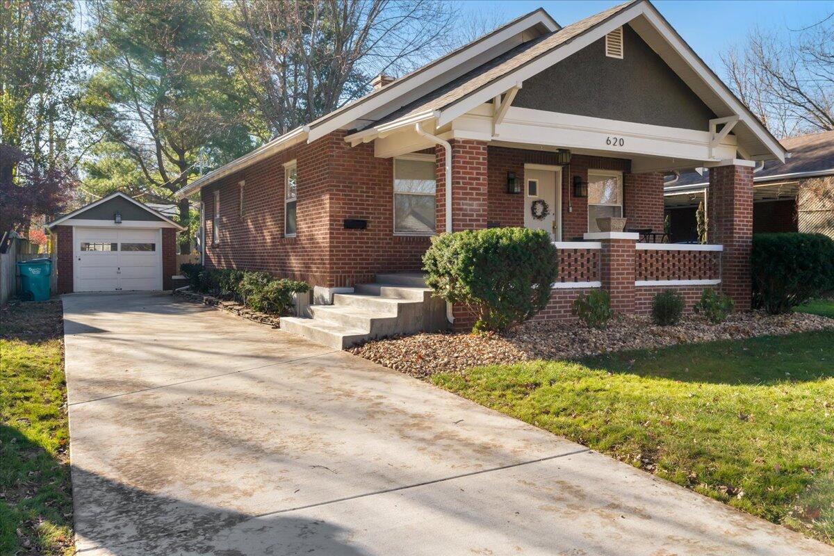 Welcome to 620 E Stanford! This beautifully updated 2 bedroom 1 bathroom bungalow is nestled in the highly sought-after University Heights subdivision. Enjoy the convenience of central location, being only minutes away from Mercy Hospital, MSU, the Art Museum, and Phelps Grove Park. This timeless 1926 gem has stood the test of time and is the perfect blend of modern updates and classic character including ached doorways, original glass doorknobs, and built-in shelves. So much time and love has been poured into this home, ensuring peace of mind for future owners! Within the last 3 years updates include: new roof, HVAC, gutters, and a new poured concrete driveway, front steps and front porch. This fall the backyard was fully sod and all new landscaping was put in for added curb appeal. Step inside to be greeted by the cozy fireplace and beautiful original hardwood floors which were recently refinished. The kitchen has been fully updated with quartz countertops, and stainless steel appliances. The additional living space off the kitchen would make an excellent formal dining area or office. Both bedrooms are generously sized and there's ample natural light throughout. The large unfinished basement offers plenty of storage room or potential for customization. Relax on the spacious back deck with room for outdoor living and enjoy the shade provided by large mature trees and a lush backyard. Don't miss your chance to own a piece of history with this darling bungalow!